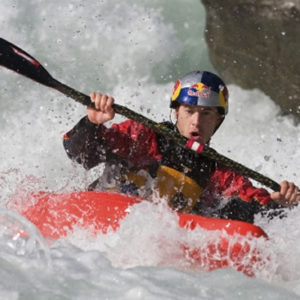 Kayaker running through white water